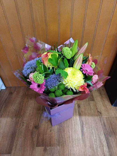 Colour Pop - A bright and beautiful mix of pinks, purples, yellows and limes would cheer up any recipient. In an aqua pack and delivered in a pretty presentation box. Flowers & colours may vary