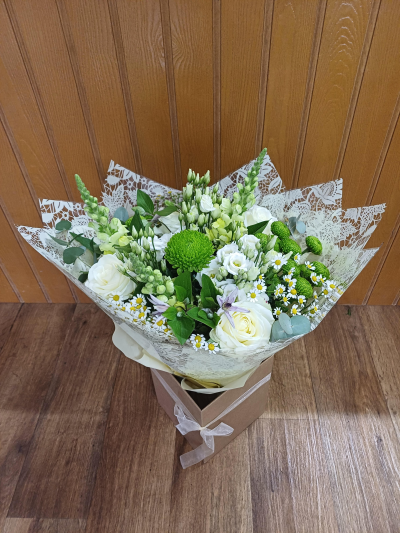 Simple Elegance - Stunning bouquet of classic white and green flowers. Flowers may vary.