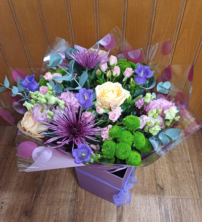 Purple Pop - A beautiful explosion of colurful seasonal flowers. Flowers and colours may vary.